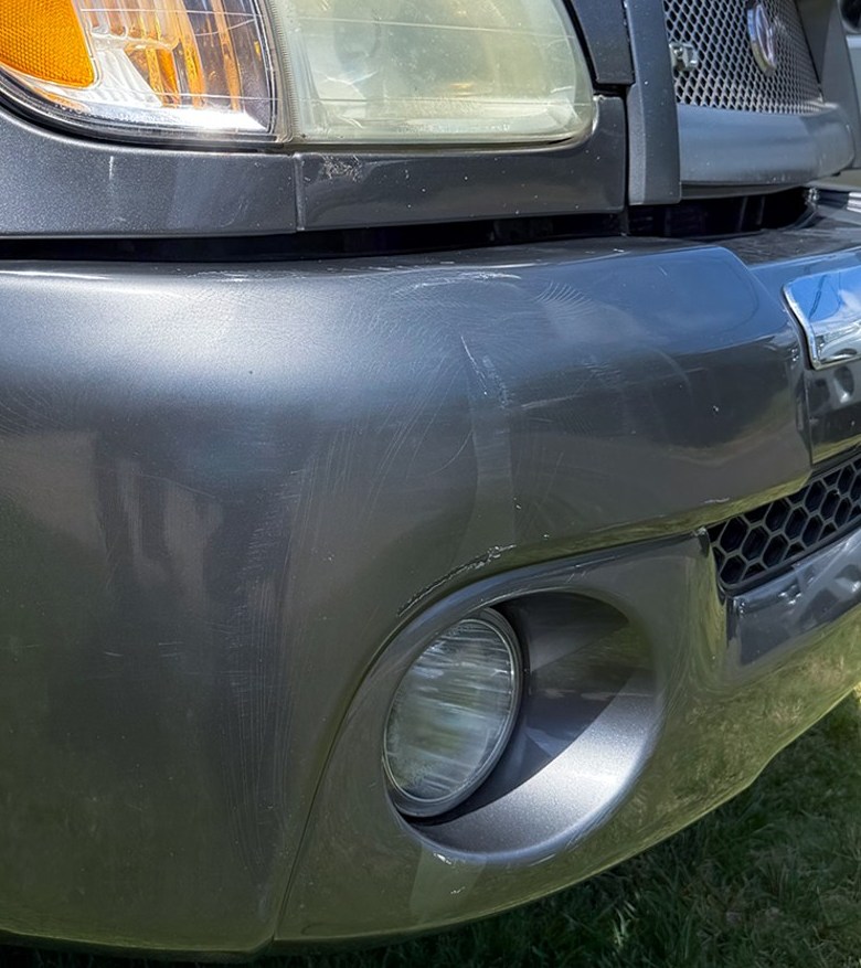 Truck bumper after paintless dent repair