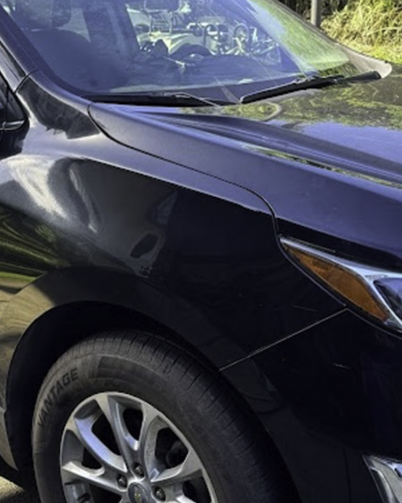 SUV front panel after paintless dent repair